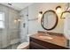 Bathroom featuring granite counters, tile shower with glass door at 1735 Flamingo Ln, Sun City Center, FL 33573