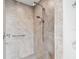 Gorgeous tile shower featuring rainfall shower head and updated fixtures at 1735 Flamingo Ln, Sun City Center, FL 33573