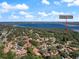 Expansive aerial view of a charming community with mature trees, close to the water and Philippe Park at 1908 Bayshore Ct, Safety Harbor, FL 34695