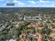Aerial view of neighborhood with residential houses and Clearwater in the distance at 1908 Bayshore Ct, Safety Harbor, FL 34695