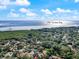 Aerial view of neighborhood near Old Tampa Bay with lush trees at 1908 Bayshore Ct, Safety Harbor, FL 34695