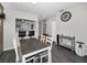 Comfortable dining room featuring a wood table and chairs plus a view of the kitchen at 1908 Bayshore Ct, Safety Harbor, FL 34695