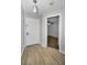 Inviting foyer features wood-look flooring and a bright entry door leading to the main living areas at 1908 Bayshore Ct, Safety Harbor, FL 34695