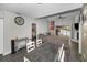 Open-concept living room with a large sectional sofa and dining space with modern decor at 1908 Bayshore Ct, Safety Harbor, FL 34695