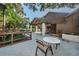 Inviting community space with a covered patio, outdoor seating, and a view of the lush landscape for relaxed gatherings at 1908 Bayshore Ct, Safety Harbor, FL 34695