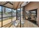 Screened patio featuring a wooden deck with outdoor seating with outdoor views at 1908 Bayshore Ct, Safety Harbor, FL 34695