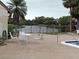 Community pool area featuring white table and chairs with scenic water view at 2716 Hidden Lake Blvd # C, Sarasota, FL 34237