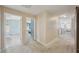 Open hallway with neutral paint, plush carpet, and doorways leading to bedrooms at 2807 Cypress Bowl Rd, Lutz, FL 33558