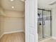 Updated bathroom featuring a seamless glass shower enclosure and an open closet at 3034 Gull Pl, Clearwater, FL 33762