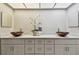 Updated bathroom boasts double vessel sinks, ample cabinet space, and modern fixtures at 3034 Gull Pl, Clearwater, FL 33762