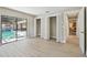 Bedroom with light wood floors, closets and sliding doors to the pool at 3034 Gull Pl, Clearwater, FL 33762