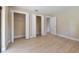Bedroom features neutral walls, light wood floors, and closet space at 3034 Gull Pl, Clearwater, FL 33762