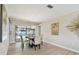 Cozy dining room featuring a modern chandelier and sliding glass doors to the pool at 3034 Gull Pl, Clearwater, FL 33762