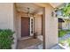 Inviting entryway features a brick landing, stylish lighting fixtures, and secure front door at 3034 Gull Pl, Clearwater, FL 33762