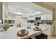 Modern kitchen with white cabinets, stainless appliances, and a skylight offering natural light at 3034 Gull Pl, Clearwater, FL 33762