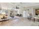 Spacious living room with vaulted ceiling, exposed beams, and modern sliding barn door at 3034 Gull Pl, Clearwater, FL 33762