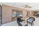Spacious covered patio with comfortable seating, offering views of the screened pool area at 3034 Gull Pl, Clearwater, FL 33762