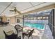 Inviting covered lanai overlooking a screened pool, perfect for outdoor relaxation and entertaining at 3034 Gull Pl, Clearwater, FL 33762