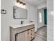 Modern bathroom vanity with wood-look cabinets, quartz countertop, and black hardware at 3101 N 15Th St, Tampa, FL 33605
