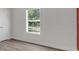 Bedroom with light flooring, neutral walls, and a new window, creating a comfortable atmosphere at 3101 N 15Th St, Tampa, FL 33605