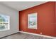 Bedroom featuring a new window, light flooring, and a neutral colored accent wall at 3101 N 15Th St, Tampa, FL 33605