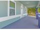 Inviting front porch featuring classic columns, ample space, and a welcoming entrance to the home at 3101 N 15Th St, Tampa, FL 33605