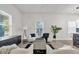 Elegant living room featuring stylish decor, natural light, and a comfortable seating arrangement at 3101 N 15Th St, Tampa, FL 33605