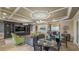 Spacious clubhouse area with coffered ceilings, modern lighting fixtures, and comfortable seating arrangements at 34329 Evergreen Hill Ct, Wesley Chapel, FL 33545