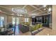 Inviting clubhouse with a comfortable lounge area, media center, and access to the outdoor pool area at 34329 Evergreen Hill Ct, Wesley Chapel, FL 33545