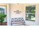 The Watergrass Club entrance with bench seating and window at 34329 Evergreen Hill Ct, Wesley Chapel, FL 33545
