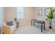 Comfortable home office area with natural lighting, stylish decor, and a tranquil ambiance at 34329 Evergreen Hill Ct, Wesley Chapel, FL 33545
