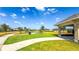 Community park featuring playground, basketball court, green space and covered seating area at 34329 Evergreen Hill Ct, Wesley Chapel, FL 33545