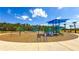 Community playground with colorful play structures and ample space for children to enjoy outdoor activities at 34329 Evergreen Hill Ct, Wesley Chapel, FL 33545