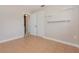 Bedroom with tile floors, built in shelves, neutral paint, and a closet at 4 Oakland Hills Ct, Rotonda West, FL 33947