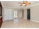 Open-concept living space with tile floors, ceiling fan, and natural light at 4 Oakland Hills Ct, Rotonda West, FL 33947