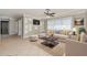 Bright living room with neutral décor, ceiling fan, and tile floors at 4 Oakland Hills Ct, Rotonda West, FL 33947