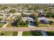 Aerial view of a home with lush landscaping and a sparkling pool in a quiet neighborhood at 4127 53Rd S Ave, St Petersburg, FL 33711