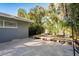 Backyard area with a basketball hoop, deck, lounging furniture, and mature landscaping at 4127 53Rd S Ave, St Petersburg, FL 33711
