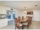 Elegant dining room features a chandelier, large table, and access to the pool area at 4127 53Rd S Ave, St Petersburg, FL 33711