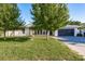 Charming single-story home featuring a well-manicured lawn and mature trees providing ample shade at 4127 53Rd S Ave, St Petersburg, FL 33711