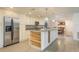 Open-concept kitchen with stainless steel appliances, granite countertops, and spacious island at 4127 53Rd S Ave, St Petersburg, FL 33711