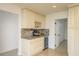Kitchen features custom cabinets, granite countertops, a wine rack, and a beverage fridge at 4127 53Rd S Ave, St Petersburg, FL 33711