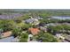 Beautiful aerial view of a home surrounded by lush greenery and waterfront views at 441 Village Dr, Tarpon Springs, FL 34689