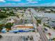 Aerial view of a bustling town with a waterfront featuring numerous boats and buildings at 441 Village Dr, Tarpon Springs, FL 34689