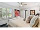 Comfortable bedroom with window and a queen size bed at 441 Village Dr, Tarpon Springs, FL 34689