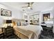 Bedroom with plush carpet, mirrored closet, and desk at 441 Village Dr, Tarpon Springs, FL 34689
