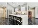 Bright kitchen featuring modern appliances, sleek white cabinets, and an island with seating at 441 Village Dr, Tarpon Springs, FL 34689