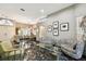 Open-concept living area with black marble floors and abundant natural light at 441 Village Dr, Tarpon Springs, FL 34689