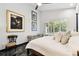 Serene bedroom features bright natural light, calming colors, and black marble flooring with an artistic aesthetic at 441 Village Dr, Tarpon Springs, FL 34689