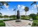 Memorial monument overlooking a scenic lake with clear blue skies at 441 Village Dr, Tarpon Springs, FL 34689
